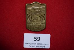 Machnow Factory Jubilee Badge, Berlin 1934, a rectangular gilt pressed badge depicting factory