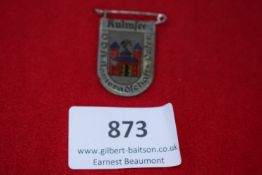 Kulmsee VDA Tinnie, a pressed-tin badge with enamel finish, depicting the arms of Kulmsee with red