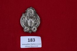 Kreis Turnfest Badge, Reichenberg 1907, a silvered cast metal badge showing saintly figure and