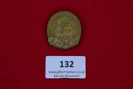 Garmisch Badge, 1930, a gilt-finish oval badge depicting a couple in traditional dress, inscribed