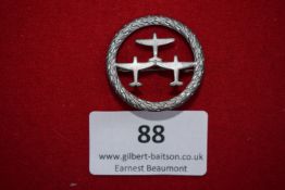 Luftwaffe Air Defence badge (tinnie), circular wreath enclosing three aircraft in flight.