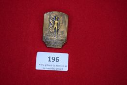 Internationale Arbeiter Olympiade Frankfurt 1925 Badge, a bronze badge showing nude male figure