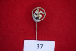 Swastika Stickpin, a small circular cut-out stickpin with swastika design, silvered finish, on