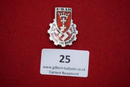 German Labour Front Rally Badge, Danzig 1934, a cogwheel-shaped silvered and enamel badge, inscribed