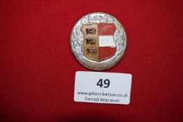 Austrian Tyrol Badge, a circular silvered and enamelled badge with edelweiss border, central