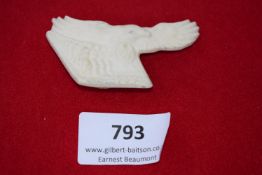 Porcelain Eagle Badge, a white porcelain badge in the form of an eagle with outstretched wings,