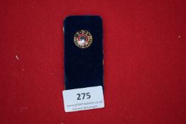 D.D.V. Badge, a circular enamel badge inscribed 