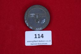 Winter Games Badge, Oberhof 1936, a circular grey metal badge inscribed Winterkampfspiele Oberhof