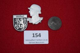 Mixed Lot of Badges (3), comprising Düsseldorf crest shield, profile soldier’s head, and 1937