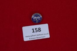DRA Sports Badge, a small round blue and white enamel badge with raised figure and letters DRA.