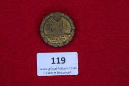 Regimental Day Badge, Dessau 1939, a circular bronze badge with castle scene within oakleaf