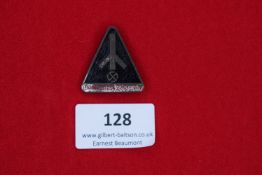 SA Rally Badge, a triangular black and silver enameled badge, inscribed with runic design and