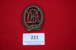 DRL Sports Badge, bronze grade, oval wreath enclosing DRL monogram, reverse maker marked.