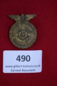 Wehrsporttage Badge, Salzuflen 1938, a circular bronze-finish badge with central flower motif on a