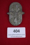 Reichskolonialtagung Badge, Vienna, 1939, a pressed zinc badge with eagle over map motif,