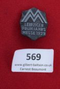 Leipziger Frühjahrsmesse 1929 badge. Blackened pressed metal, stylised “M” with rays and text.