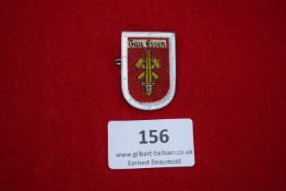 Gau Essen Badge, a shield-shaped red cloth-backed badge with yellow fasces motif and eagle,