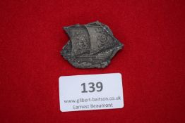Tinnie Badge (Damaged), a zinc badge with crossed flags and eagle, marked G. Friedmann, Hanau, 1939,