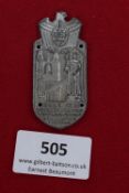 NSKK Badge, Halle 1936, a pressed tin badge with eagle and swastika above cityscape and knight