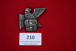 Gautreffen Badge, die-cast eagle clutching tablet inscribed 
