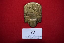 District Gymnastics Festival Badge, Bad Rappenau 1932, a gilt pressed badge depicting rearing