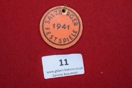 Salzburger Festspiele Badge, 1941, a simple round printed card badge in orange, inscribed Salzburger