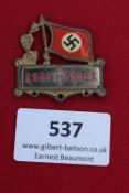 Kraftfahrer Badge, a rectangular badge with red enamel swastika flag above oakleaf cluster and