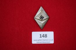 Hitler Youth Membership Badge, a silver-toned diamond-shaped badge with black swastika to the