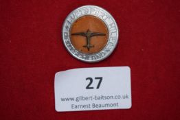 Luftsport Hilft Deutschland Badge, a circular aluminium badge with orange centre panel depicting
