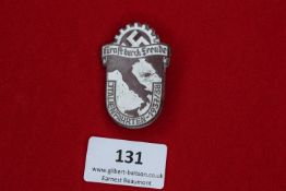 KdF Italy Trip Badge, 1937/38, a grey metal badge with cogwheel and swastika, inscribed Kraft