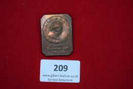 Commemorative Badge, bronze rectangular plaque with portrait bust within wreath, inscribed for the