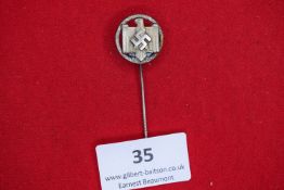 NSRL Stickpin, a small circular silvered stickpin, eagle with swastika at centre, reverse