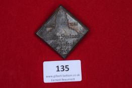 Sports Meeting Badge, 1931, a square pressed-tin badge with raised lettering, inscribed