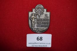 Rhein Jäger Days Badge, Düren 1933, a silvered shield-shaped badge depicting hunter with bugle,