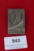 Kraft durch Freude Holiday Badge 1934, a rectangular pressed alloy badge showing a stylised ship