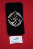 Commemorative Badge 1925, a silver and black enamel swastika badge with oak leaf wreath surround.