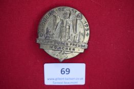 KdF Oktoberfest Badge, München 1934, a circular bronze badge depicting the Münchner Kindl above city