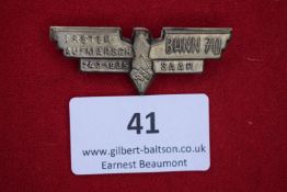 Hitler Youth Bann 70 Saar Badge, 1935, a silvered wing-shaped badge inscribed Erster Aufmarsch