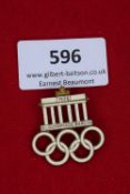 1936 Berlin Olympics Badge, a gilt and enamel badge depicting the Brandenburg Gate above the five