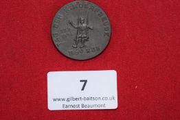 NSV “Day of Children’s Joy” Badge, 1934, a circular pressed metal badge depicting a child on a