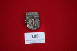 Ski Club Schönwald Badge, a white-metal badge depicting ski jumper in action, inscribed “Ski-Klub