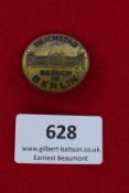 Reichstag Visit in Berlin Badge, a circular brass badge featuring a depiction of the Reichstag