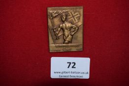 Gymnastics Federation Festival Badge, Eger 1938, a rectangular bronze badge depicting athlete with
