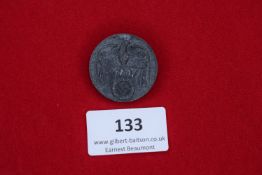 Day Badge, 1939, a grey round pressed-tin badge showing eagle and swastika, reverse stamped Tag