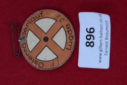 Osteranderlauf 1938 Badge, a circular pressed card badge with brown printed design featuring a cross