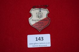 Neumünster Folk Festival Badge, 1936, a pressed card shield-shaped badge, printed with eagle and