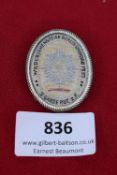 Woven Reunion Badge, Berlin 1935, oval badge in silvered frame, white woven ground with starburst