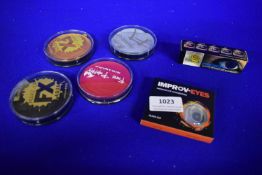 Assorted Face Paints and Contact Lenses