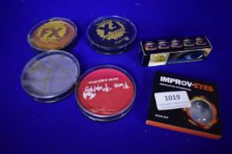 Assorted Face Paints and Contact Lenses