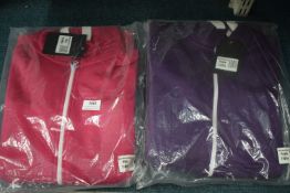 2x Kid’s Hooded Onesies Size: 7-8 years (1x pink, 1x purple)
